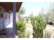 Lush front yard with mature landscaping, a walkway, and a covered porch at 2718 W Montebello Ave, Phoenix, AZ 85017