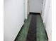 Hallway featuring durable tile flooring, and bright white walls at 2718 W Montebello Ave, Phoenix, AZ 85017