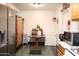 Eat-in kitchen with marble table, stainless steel refrigerator, and abundant storage at 2718 W Montebello Ave, Phoenix, AZ 85017