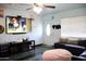 Cozy living room featuring modern decor, a TV, and a comfortable seating area at 2718 W Montebello Ave, Phoenix, AZ 85017