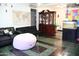 Open-concept living space featuring tile flooring, a china cabinet, and a fish tank at 2718 W Montebello Ave, Phoenix, AZ 85017