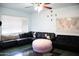 Bright living room with tile flooring, large sectional sofa, and ceiling fan at 2718 W Montebello Ave, Phoenix, AZ 85017