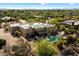 Aerial view of a home with a pool, desert landscaping, and comfortable seating area at 27203 N 64Th Way, Scottsdale, AZ 85266