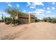 Large garage with two doors and desert landscaping at 27203 N 64Th Way, Scottsdale, AZ 85266