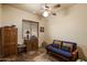 Relaxing living room with comfortable seating, warm lighting, and rustic furnishings at 27203 N 64Th Way, Scottsdale, AZ 85266