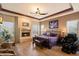 Comfortable main bedroom suite with fireplace, ceiling fan and king size bed at 27203 N 64Th Way, Scottsdale, AZ 85266