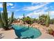 Inviting pool area with mature cacti, blue skies, and turquoise water at 27203 N 64Th Way, Scottsdale, AZ 85266