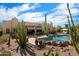 Inviting backyard oasis with a private pool surrounded by desert landscaping and cozy lounge areas at 27203 N 64Th Way, Scottsdale, AZ 85266