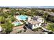 Stunning aerial view of community pool and hot tub, surrounded by lush landscaping and cozy cabanas at 29431 N 122Nd Gln, Peoria, AZ 85383