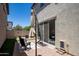 Private backyard featuring a patio, comfortable seating, and well-maintained landscaping at 29431 N 122Nd Gln, Peoria, AZ 85383