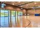 Indoor basketball court with hardwood floors and glass doors letting in natural light at 29431 N 122Nd Gln, Peoria, AZ 85383