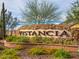Attractive stone sign for the Vistancia community, complemented by colorful plants and desert landscape at 29431 N 122Nd Gln, Peoria, AZ 85383
