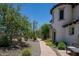 Beautiful home exterior with a well-kept landscape, inviting walkway, and lush trees at 29431 N 122Nd Gln, Peoria, AZ 85383