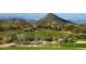 Well-manicured golf course with rolling hills and mountain views in the background at 29431 N 122Nd Gln, Peoria, AZ 85383