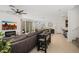 Spacious living room featuring tile floors, neutral decor, and seamless integration with the dining and kitchen areas at 29431 N 122Nd Gln, Peoria, AZ 85383