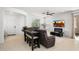 Relaxing living space with a sectional sofa, tile flooring, and an open floor plan perfect for entertaining and comfortable living at 29431 N 122Nd Gln, Peoria, AZ 85383