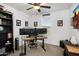 Well-lit office space with a large desk, multiple monitors, and comfortable seating at 29431 N 122Nd Gln, Peoria, AZ 85383