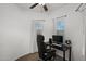 Home office with a desk, chair, and natural light from windows at 29431 N 122Nd Gln, Peoria, AZ 85383