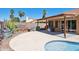 Inviting backyard features a covered patio, desert landscaping, and a refreshing pool, perfect for outdoor relaxation and enjoyment at 3133 E Redwood Ct, Phoenix, AZ 85048