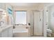 Bright bathroom featuring large tub, shower, and plenty of counter space at 3133 E Redwood Ct, Phoenix, AZ 85048