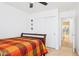 Bedroom featuring neutral walls, closet with sliding doors, and a peek into the bathroom at 3133 E Redwood Ct, Phoenix, AZ 85048