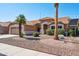Inviting single-story home with desert landscaping, a spacious two-car garage and a tile roof at 3133 E Redwood Ct, Phoenix, AZ 85048
