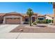 Charming single-story home featuring a low-maintenance desert landscape and a two-car garage at 3133 E Redwood Ct, Phoenix, AZ 85048