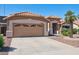 Single story home featuring a desert landscaped front yard and a large two car garage at 3133 E Redwood Ct, Phoenix, AZ 85048