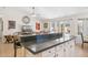 Open kitchen with granite counters, breakfast bar and view into living room and backyard at 3133 E Redwood Ct, Phoenix, AZ 85048