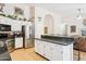 Spacious kitchen with white cabinets, granite countertops, and stainless steel refrigerator at 3133 E Redwood Ct, Phoenix, AZ 85048