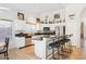Bright kitchen featuring granite countertops, stainless steel appliances, and a breakfast bar at 3133 E Redwood Ct, Phoenix, AZ 85048