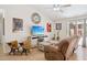 Cozy living room with tile floors, a ceiling fan, and sliding glass doors to the exterior at 3133 E Redwood Ct, Phoenix, AZ 85048