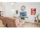 Relaxing living room with comfortable sofa, tile floors, and decorative wall art at 3133 E Redwood Ct, Phoenix, AZ 85048