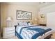 Comfortable main bedroom with large bed, side tables and decorative artwork at 3133 E Redwood Ct, Phoenix, AZ 85048