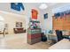 Spacious home office featuring a built-in desk, plenty of storage, and view into the living room at 3133 E Redwood Ct, Phoenix, AZ 85048