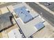 Aerial view of the property with gravel landscaping, storage building, and new roof at 346 W Edgemont Ave, Phoenix, AZ 85003