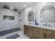 Stunning bathroom featuring double vanities, modern fixtures, and a spacious walk-in shower with dual shower heads at 346 W Edgemont Ave, Phoenix, AZ 85003