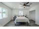 Charming bedroom featuring a ceiling fan, hardwood floors, and natural light at 346 W Edgemont Ave, Phoenix, AZ 85003
