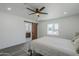 Bedroom offers hardwood floors, ceiling fan and natural light from the window at 346 W Edgemont Ave, Phoenix, AZ 85003