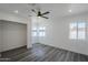 Bright bedroom with laminate flooring, a ceiling fan, recessed lighting, and a window for natural light at 346 W Edgemont Ave, Phoenix, AZ 85003