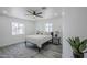 Bright bedroom with a ceiling fan, and lots of natural light coming in from the two windows at 346 W Edgemont Ave, Phoenix, AZ 85003