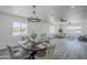 Dining space with a round table, chandelier, and windows providing natural light at 346 W Edgemont Ave, Phoenix, AZ 85003