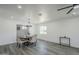 Bright dining room with a modern chandelier and lots of natural light at 346 W Edgemont Ave, Phoenix, AZ 85003