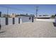 Exterior of building shows neutral paint with a modern paint scheme and a gravel yard at 346 W Edgemont Ave, Phoenix, AZ 85003
