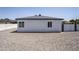 Exterior of building shows neutral paint with a modern paint scheme and a gravel yard at 346 W Edgemont Ave, Phoenix, AZ 85003