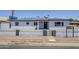 An exterior view of the home showcasing a grey privacy wall at 346 W Edgemont Ave, Phoenix, AZ 85003