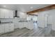 Open kitchen area with white cabinets, quartz countertops, and dark fixtures and hardware at 346 W Edgemont Ave, Phoenix, AZ 85003