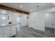 Bright kitchen with white cabinets and quartz countertops leading to the dining and living spaces at 346 W Edgemont Ave, Phoenix, AZ 85003