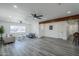 Spacious living room with hardwood floors, recessed lights, and modern ceiling fans at 346 W Edgemont Ave, Phoenix, AZ 85003