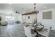 Spacious open-concept layout with a dining table and adjacent living area at 346 W Edgemont Ave, Phoenix, AZ 85003